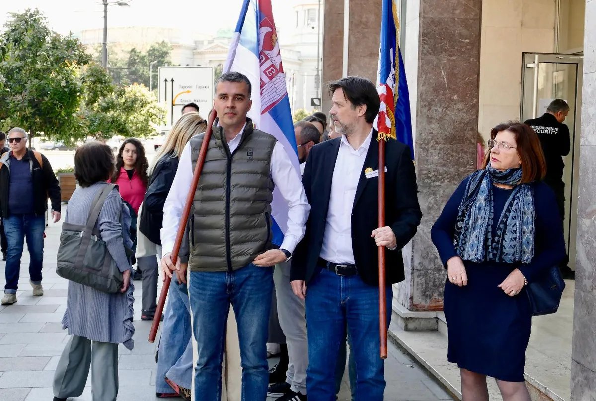 Opposition walks out of Belgrade city assembly session, marches 20 km